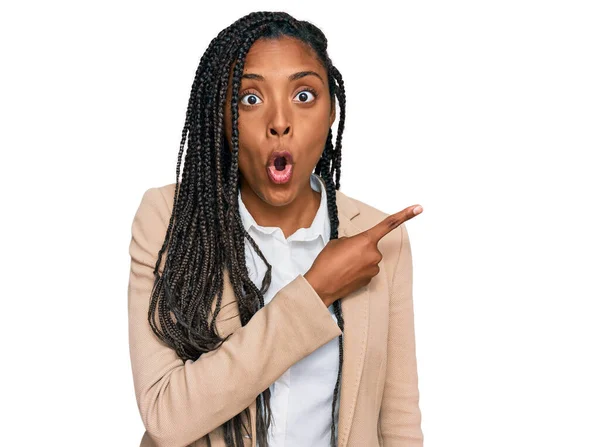 African American Woman Wearing Business Jacket Surprised Pointing Finger Side — Stock Photo, Image
