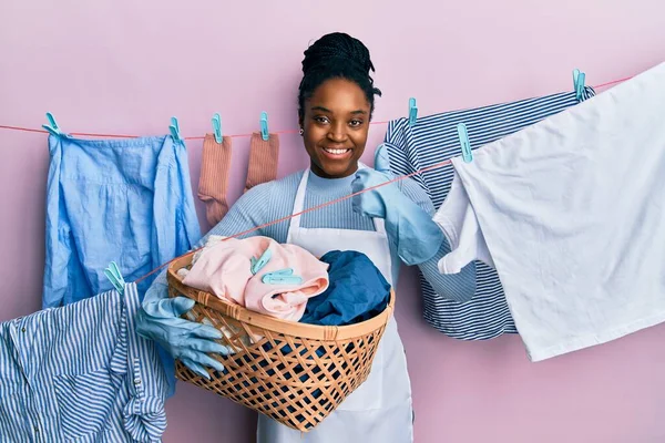 African American Woman Braided Hair Doing Laundry Holding Wicker Basket —  Fotos de Stock