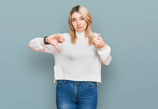 Young Caucasian Woman Wearing Casual Winter Sweater Doing Thumbs Disagreement — Stock Photo, Image