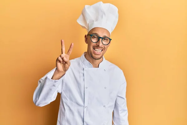 Bald Man Beard Wearing Professional Cook Uniform Showing Pointing Fingers — Stock Photo, Image