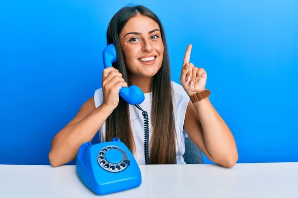 Beautiful Hispanic Woman Speaking Vintage Telephone Smiling Idea Question Pointing — Stock Photo, Image