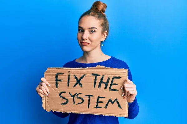 Young Blonde Woman Holding Fix System Banner Cardboard Relaxed Serious — Stock Photo, Image