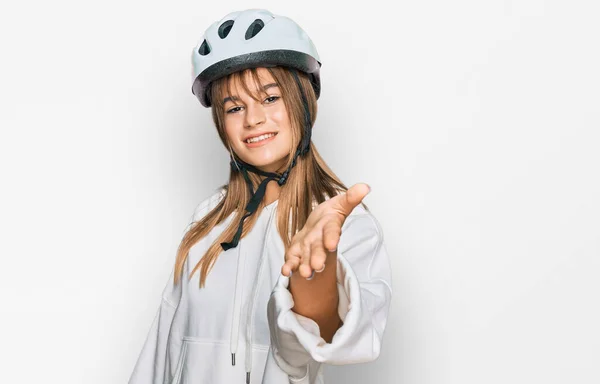 Teenager Caucasian Girl Wearing Bike Helmet Smiling Friendly Offering Handshake — Stock Photo, Image