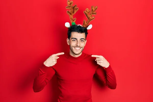 Young Hispanic Man Wearing Cute Christmas Reindeer Horns Smiling Cheerful — Foto de Stock