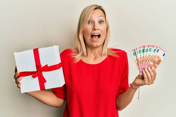 Middle Age Caucasian Woman Holding Gift Euros Banknotes Celebrating Crazy — Stock Photo, Image