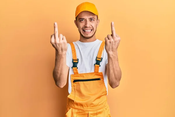 Hispanic Young Man Wearing Handyman Uniform Showing Middle Finger Doing — Foto de Stock