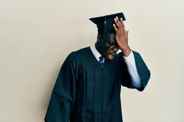Handsome Black Man Wearing Graduation Cap Ceremony Robe Surprised Hand — Stock Photo, Image