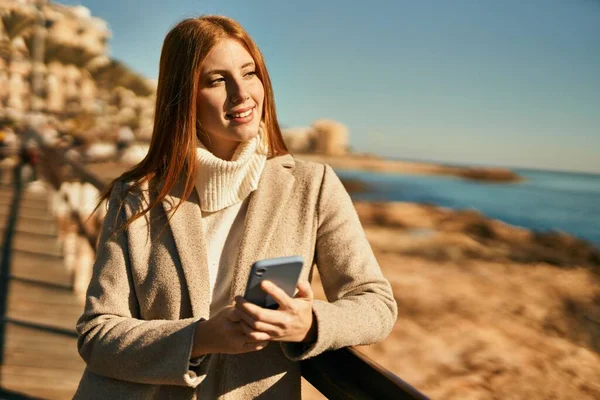 Young Redhead Girl Smiling Happy Using Smartphone Beach — Stock Photo, Image