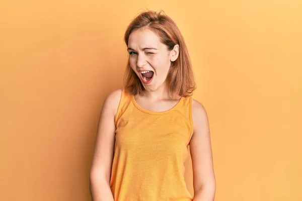 Young Caucasian Woman Wearing Casual Style Sleeveless Shirt Winking Looking — Stock Photo, Image