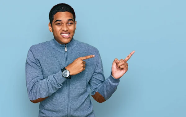 Young Handsome Hispanic Man Wearing Casual Sweatshirt Pointing Aside Worried — Stock Photo, Image