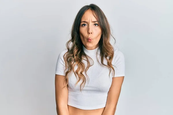 Young Brunette Woman Wearing Casual White Shirt Making Fish Face — Stock Photo, Image