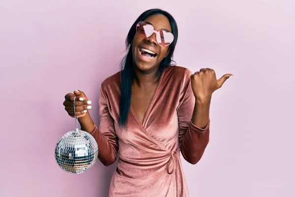 Young African American Woman Wearing Sexy Party Dress Holding Disco Royalty Free Stock Images