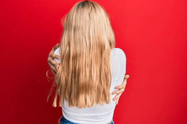 Young Caucasian Woman Wearing Casual White Shirt Hugging Oneself Happy — Stock Photo, Image