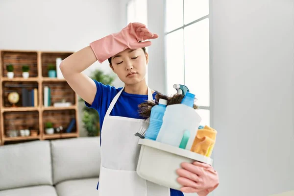 Young Chinese Housewife Tired Holding Cleaning Products Standing Home — Stock Photo, Image