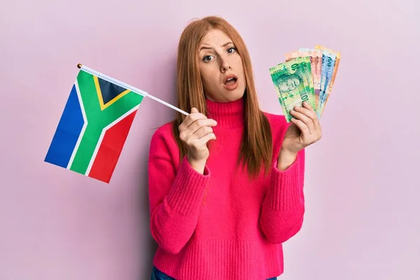 Young Irish Woman Holding South Africa Flag Rand Banknotes Shock — Stock Photo, Image