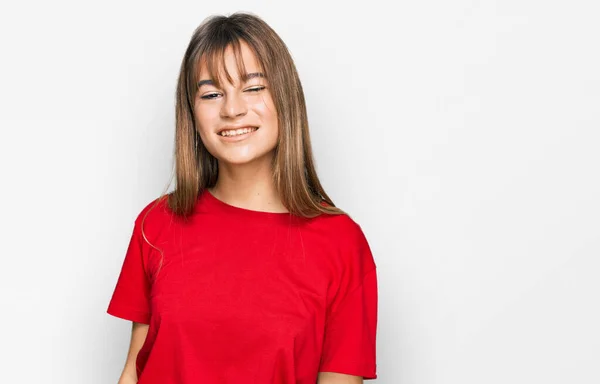 Teenager Caucasian Girl Wearing Casual Red Shirt Winking Looking Camera — Stock Photo, Image