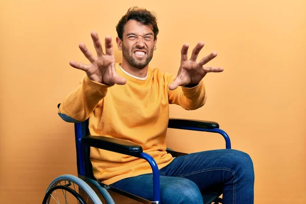 Handsome Man Beard Sitting Wheelchair Smiling Funny Doing Claw Gesture — Stock Photo, Image