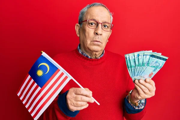 Handsome Senior Man Grey Hair Holding Malaysia Flag Malaysian Ringgit — Stock Photo, Image