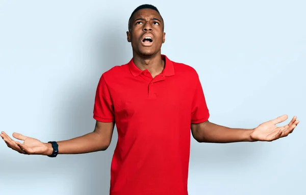 Young African American Man Wearing Casual Red Shirt Crazy Mad — Stock Photo, Image