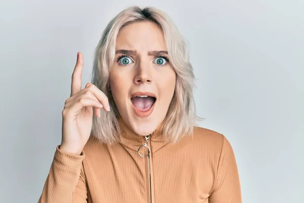 Young Blonde Girl Wearing Casual Clothes Pointing Finger Successful Idea — Stock Photo, Image