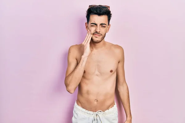 Young Hispanic Man Wearing Swimwear Shirtless Touching Mouth Hand Painful — Stock Photo, Image