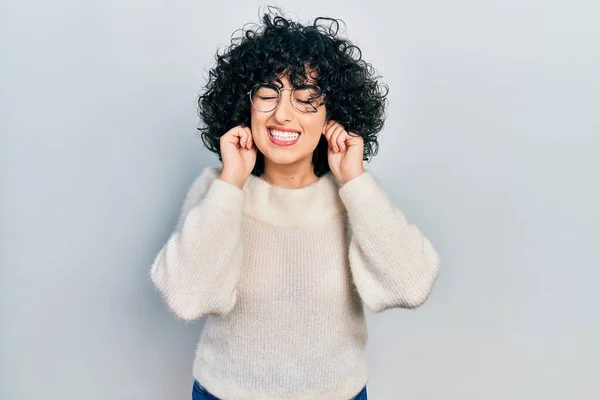 Young Middle East Woman Wearing Casual White Tshirt Covering Ears — 스톡 사진