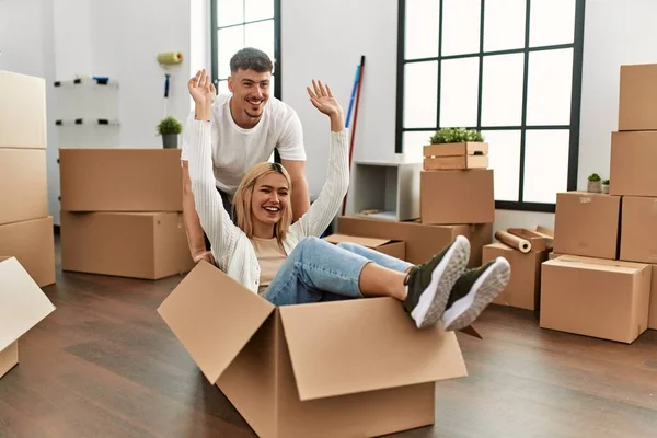 Young Caucasian Couple Smiling Happy Playing Cardboard Box Car New — Stock Photo, Image