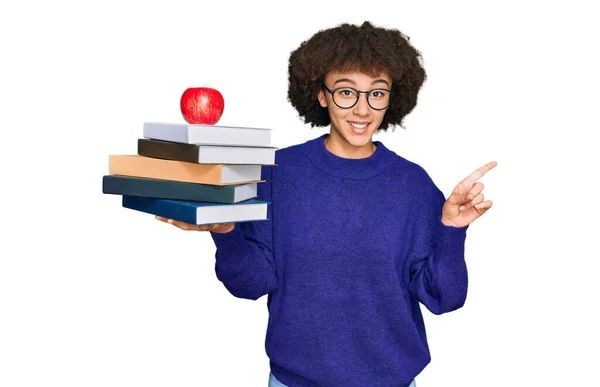 Young Hispanic Girl Wearing Glasses Holding Books Red Apple Smiling — Stock Photo, Image