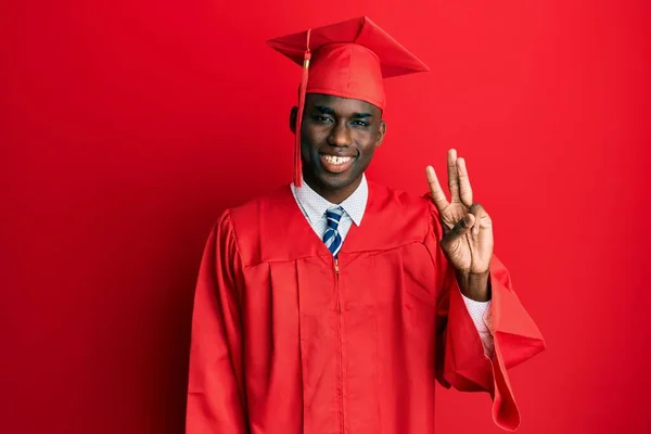 Young African American Man Wearing Graduation Cap Ceremony Robe Showing — Stock Photo, Image