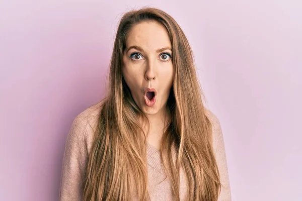 Young Blonde Woman Wearing Casual Sweater Scared Amazed Open Mouth — Stock Photo, Image