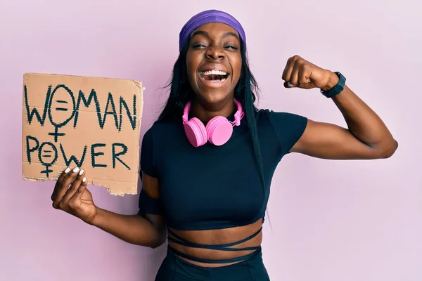 Young African American Girl Wearing Sportswear Holding Woman Power Banner — Fotografia de Stock