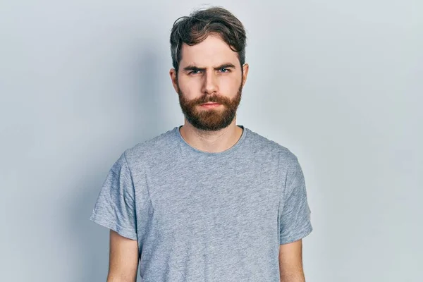 Caucasian Man Beard Wearing Casual Grey Shirt Skeptic Nervous Frowning — 图库照片