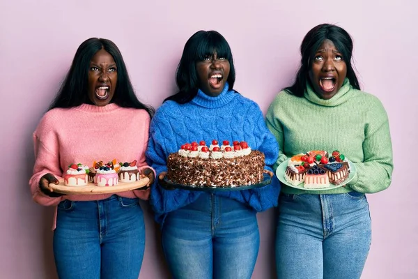Young African American Friends Celebrating Birthday Holding Cakes Angry Mad — Stock Fotó