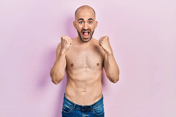 Young Bald Man Standing Shirtless Celebrating Surprised Amazed Success Arms — Stock Photo, Image