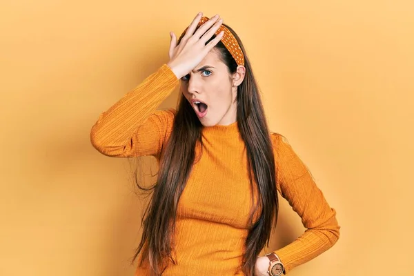 Young Brunette Teenager Wearing Casual Yellow Sweater Surprised Hand Head —  Fotos de Stock