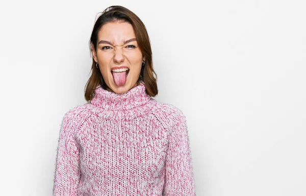 Young Caucasian Girl Wearing Wool Winter Sweater Sticking Tongue Out — 스톡 사진