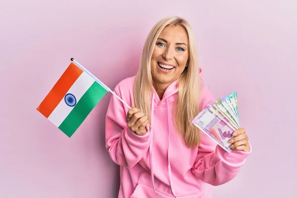 Young Blonde Woman Holding India Flag Rupee Banknotes Smiling Laughing — Φωτογραφία Αρχείου