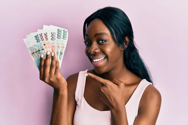 Young African American Woman Holding Czech Koruna Banknotes Smiling Happy — Foto de Stock