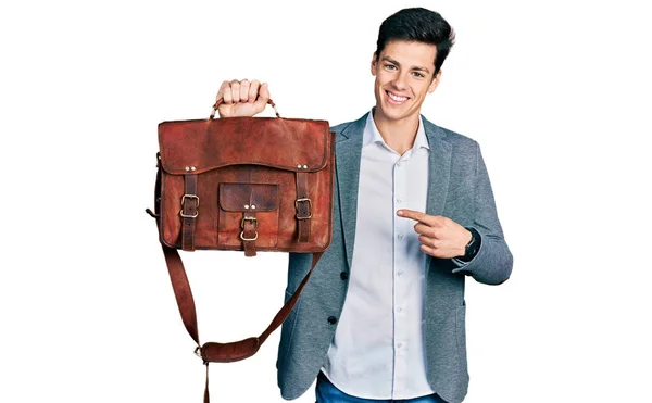 Young Hispanic Man Holding Business Bag Smiling Happy Pointing Hand — Foto de Stock