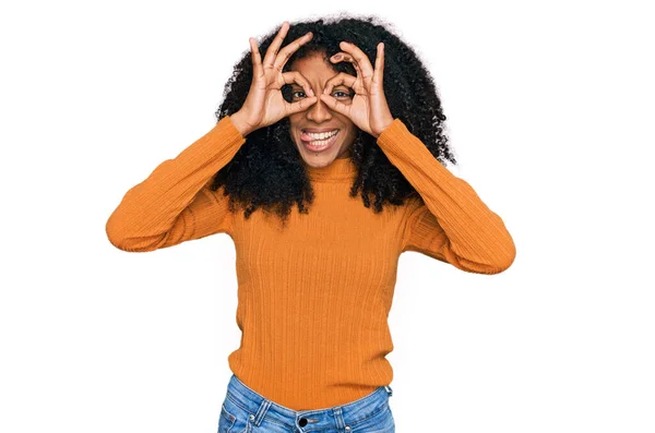 Young African American Girl Wearing Casual Clothes Doing Gesture Binoculars — Stock Photo, Image