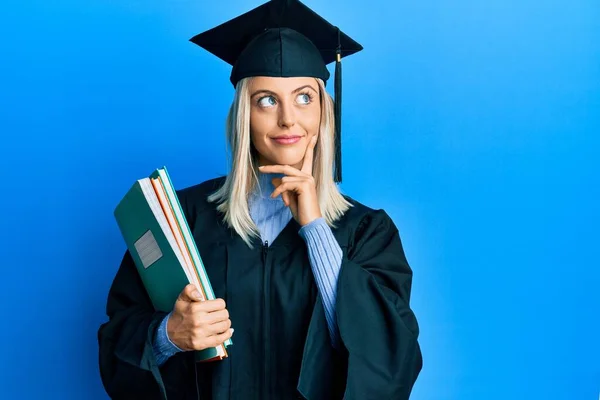 Beautiful Blonde Woman Wearing Graduation Cap Ceremony Robe Holding Books — Stock Photo, Image