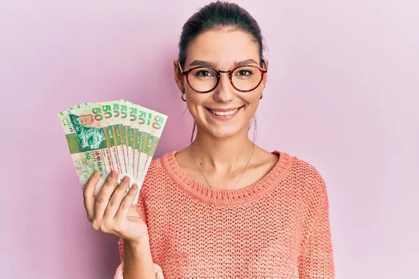 Young Caucasian Woman Holding Hong Kong Dollars Banknotes Looking Positive — Stock Photo, Image