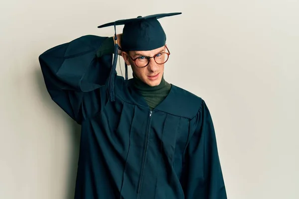 Young Caucasian Man Wearing Graduation Cap Ceremony Robe Confuse Wonder — Stock Photo, Image