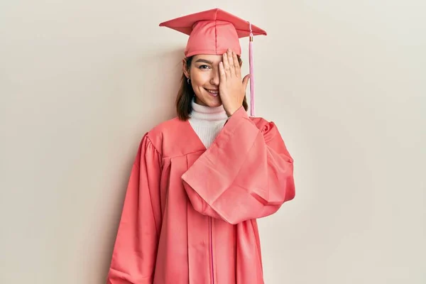 Young Caucasian Woman Wearing Graduation Cap Ceremony Robe Covering One — 스톡 사진