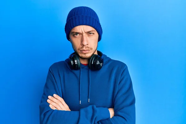 Hispanic Young Man Wearing Sweatshirt Headphones Skeptic Nervous Disapproving Expression — Stock Photo, Image