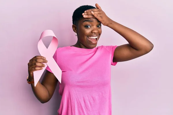 Young African American Woman Holding Pink Cancer Ribbon Stressed Frustrated — Zdjęcie stockowe