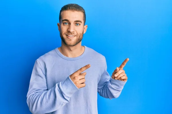 Young Caucasian Man Pointing Fingers Side Smiling Happy Cool Smile — Stock Photo, Image