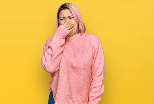 Hispanic Woman Pink Hair Wearing Casual Winter Sweater Smelling Something — Stock Photo, Image