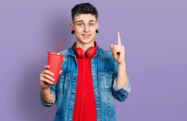 Young Caucasian Boy Ears Dilation Drinking Glass Cola Beverage Smiling — ストック写真