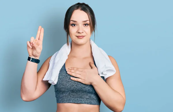 Young Hispanic Girl Wearing Sportswear Towel Smiling Swearing Hand Chest — Stock Photo, Image